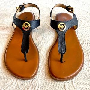 Michael Kors black flat thong sandals. Size 6.5.